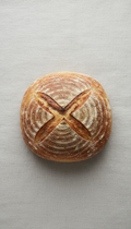 Rustic sourdough boule with cracked crust